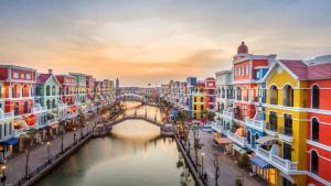 a view of a canal with buildings and a bridge at StayLa Homestay Grand World Phu Quoc in Phú Quốc