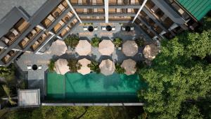 an overhead view of a pool in a building at Spark By Hilton Goa Calangute in Goa