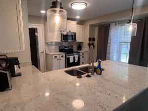 a kitchen with a sink and a counter top at Greystone Ranch Pet Friendly in Clarksville