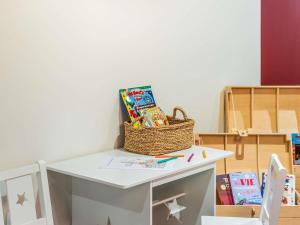a table with a basket on top of it at Aparthotel Adagio Paris Haussmann Champs Elysées in Paris