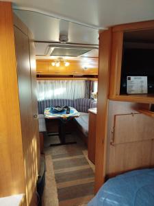 a small room with a bed and a table at DamAnda mare in Nea Potidaea +158 photos
