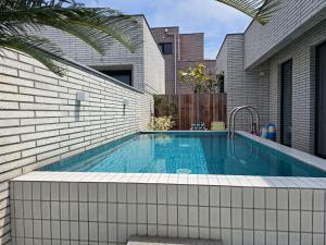 a swimming pool in front of a house at 유유히 in Sowang-dong