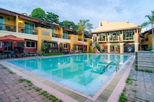 a large swimming pool in front of a building at Crown Regency Residences Davao in Davao City