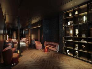 a room with a bunch of furniture and shelves at SO/ Bangkok in Bangkok