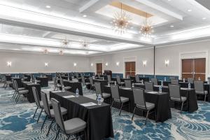 a conference room with tables and chairs and chandeliers at DoubleTree by Hilton Hotel South Bend in South Bend +67 photos