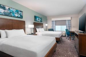 a hotel room with two beds and a desk at Hilton Garden Inn Wayne in Wayne +35 photos