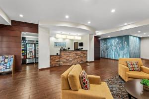 a lobby with chairs and a counter in a store at MainStay Suites Lufkin in Lufkin +33 photos