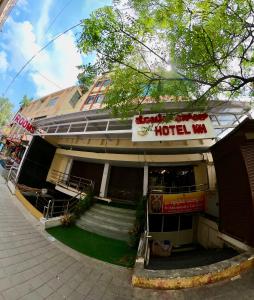a hotel with a sign on the front of it at HOTEL Nh MAJESTIC in Bangalore