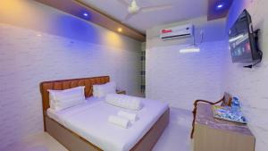 a small room with a bed and a tv at Hotel Sunrise Int in Dhaka +77 photos