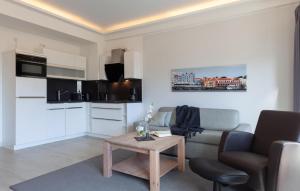 a living room with a couch and a table at Skipper in Binz