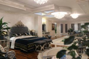 a bedroom with a king sized bed in a room at Safo Dushanbe in Dushanbe +117 photos