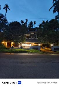 a house with a street in front of it at Easystayhomestay in Kunnamangalam