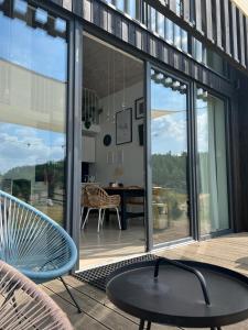 a screened in porch with a table and chairs at Siedlisko Ciemno in Ciemno +14 photos