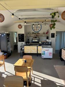 a restaurant with a table and chairs and a counter at Viking Surf & Stay in Klitmøller +22 photos