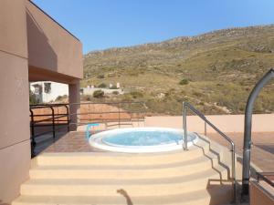 a hot tub on the patio of a house at Apartamento Playasol in Vícar