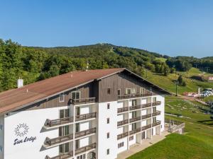 an aerial view of a building with a mountain in the background at Sun Lodge, an Ascend Collection Hotel in Peru