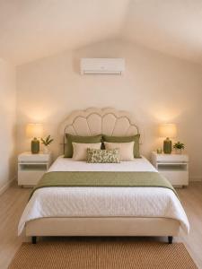a bedroom with a large bed with two night stands at La Escapade Cubaine in Villeneuve-sur-Lot +14 photos