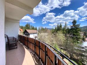 a balcony with a view of the mountains at Vila Predeal Holidays in Predeal
