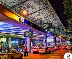 a bunch of cars parked in a parking lot at Hotel Penguin International in Kolkata