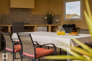 a table with glasses of orange juice and a plate of food at Villa Esplendida by Abahana Villas in Ifach