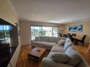 a living room with a couch and a table at Getaway, Unit 20 Seafront Estate in Jurien Bay