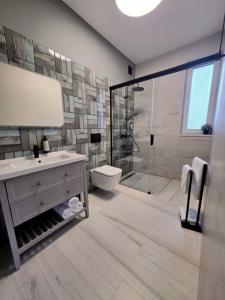 a bathroom with a shower and a sink and a toilet at Akacjowa 11 in Skorochow +29 photos