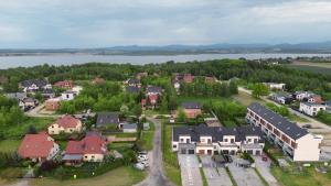 an aerial view of a town with a lake at Akacjowa 11 in Skorochow