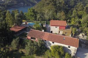 an aerial view of a house with a swimming pool at Welcome to Gerês in Ventosa