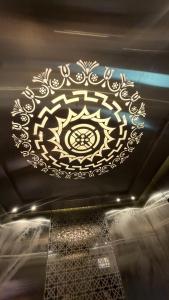 a large chandelier on the ceiling of a building at Gravity Groups Core VHR Residency in Puducherry Airpoert