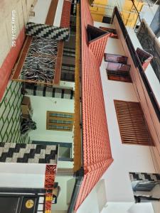 an overhead view of a building with orange roof at Kasi Heritage Home Near Sree Padmanabha Swami Temple 800m in Trivandrum