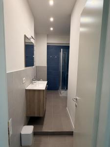 a bathroom with a sink and a toilet at Casa Pallacorda in Prato