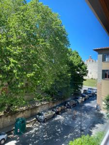 a group of cars parked in a parking lot at Casa Pallacorda in Prato