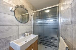 a bathroom with a sink and a shower at Sunwaves 4 - Casa Duna in El Palmar +14 photos