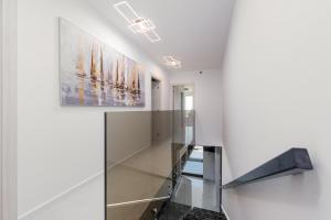 a staircase in a house with a painting on the wall at Villas Weiss in Vir +34 photos