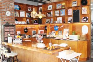 a restaurant with a counter with chairs and a counter top at 마음스테이 in Taesuha-dong +19 photos