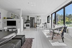 a living room with a couch and a table at 8804-Glesborg-Vesttoften-20 in Glesborg