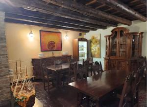 a dining room with wooden tables and chairs at Residence Oasi del Delta in Taglio di Po