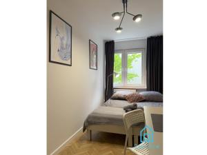 a bedroom with a bed and a window at Harbor Room at City Center Gdynia & Seaside in Gdynia