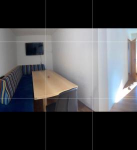 a small room with a table and a couch at Haus Brandner Judenburg in Judenburg