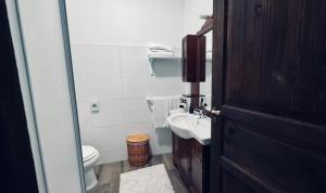 a bathroom with a toilet and a sink at Residence Oasi del Delta in Taglio di Po +44 photos