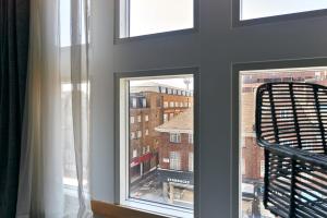 a window with a view of a building at Líbere London Edgware Road in London
