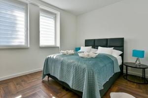 a bedroom with a bed with two bowls on it at Luxbor Villa in Eger +22 photos