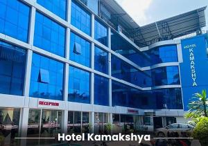 a hotel kamandaliya building with a car parked in front at Hotel Kamakshya Pvt Ltd in Kodudanga +9 photos