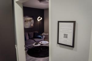 a framed picture of a living room with a couch at Apartment Nr 11 in Bremerhaven