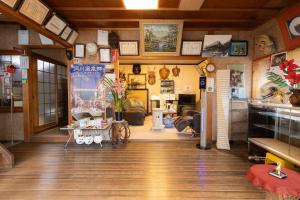 a room with a store with clocks on the walls at Ichimaru Ryokan - Vacation STAY 59281v in Tenkawa