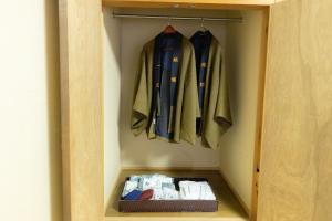 a closet with coats and a basket in it at Ichimaru Ryokan - Vacation STAY 59281v in Tenkawa