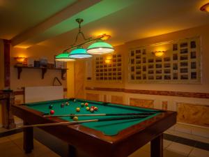 a billiard room with a pool table at Ets Levillain - Hôtel Les Calètes in Le Tréport