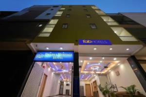 a building with a sign in front of it at FabHotel Dwarka Heritage in New Delhi