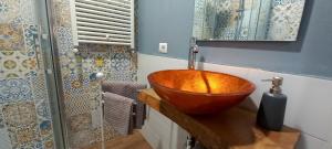 a bathroom with a copper bowl sink on a counter at Il Falcineto in Pesaro +10 photos