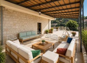 a patio with couches and a table and chairs at The Silk Valley in Arşūn